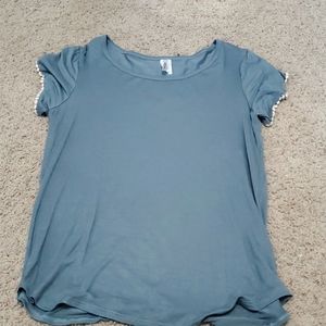 Slate blue pom-pom detail shirt.